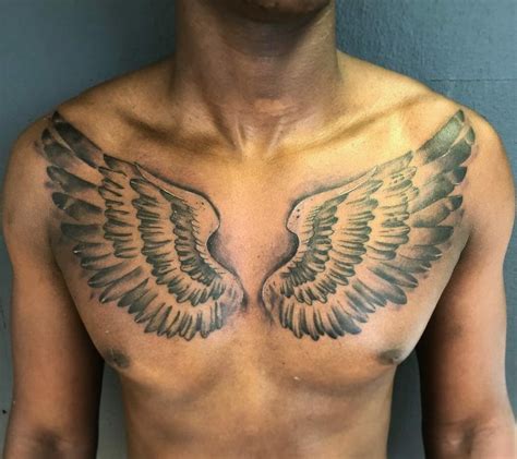 male chest tattoo designs|wing chest tattoos for men.